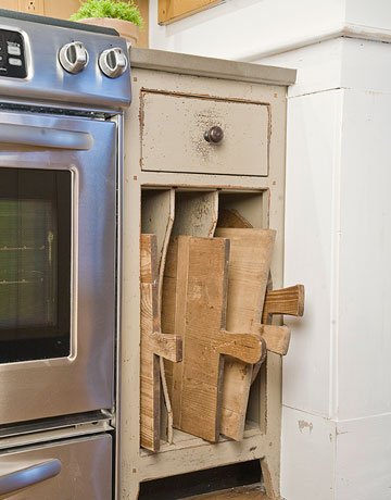 cabinet with slots for cutting boards