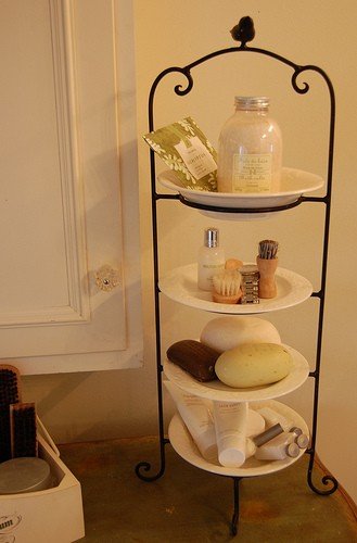 CLEVER IDEA: use a plate stand to create extra space on the bathroom counter