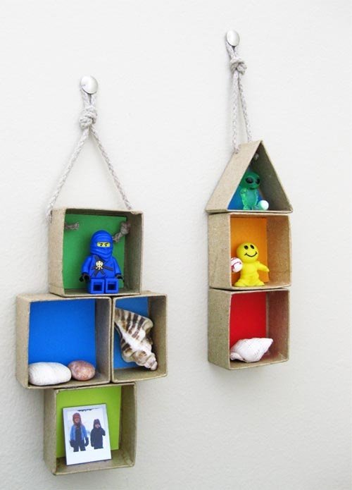 Wall decoration with boxes for kids. hmm... wonder if this would help keep random toys off floor?